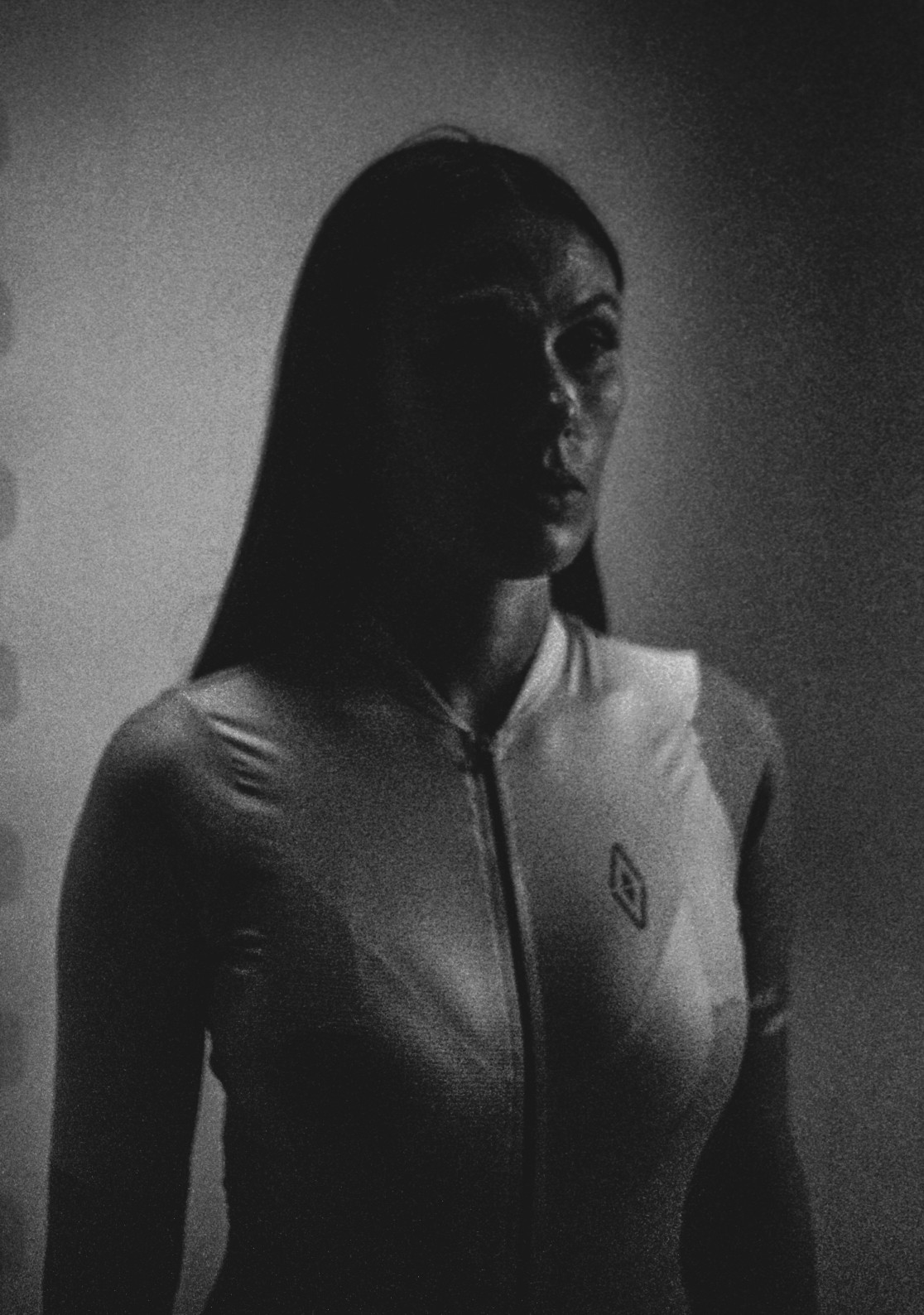 Black and white portrait of a woman in a light shirt