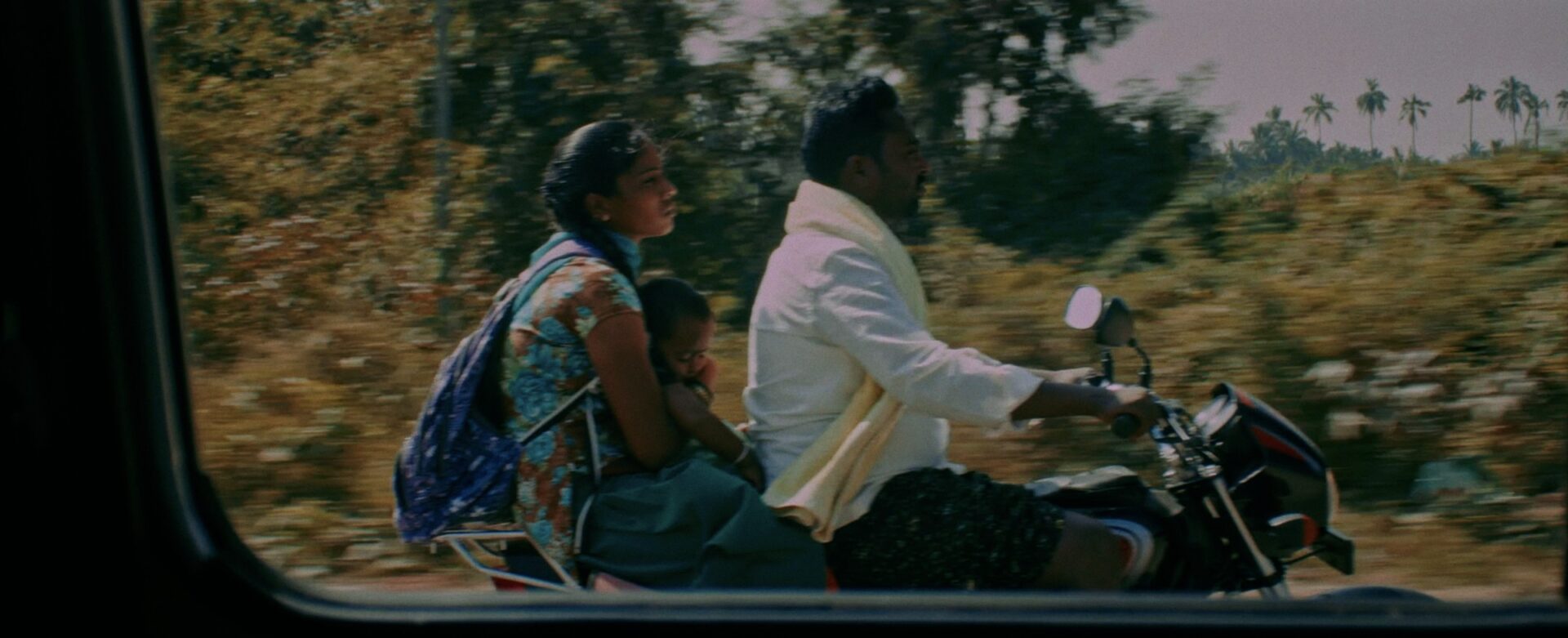 People travelling on a motorbike in India